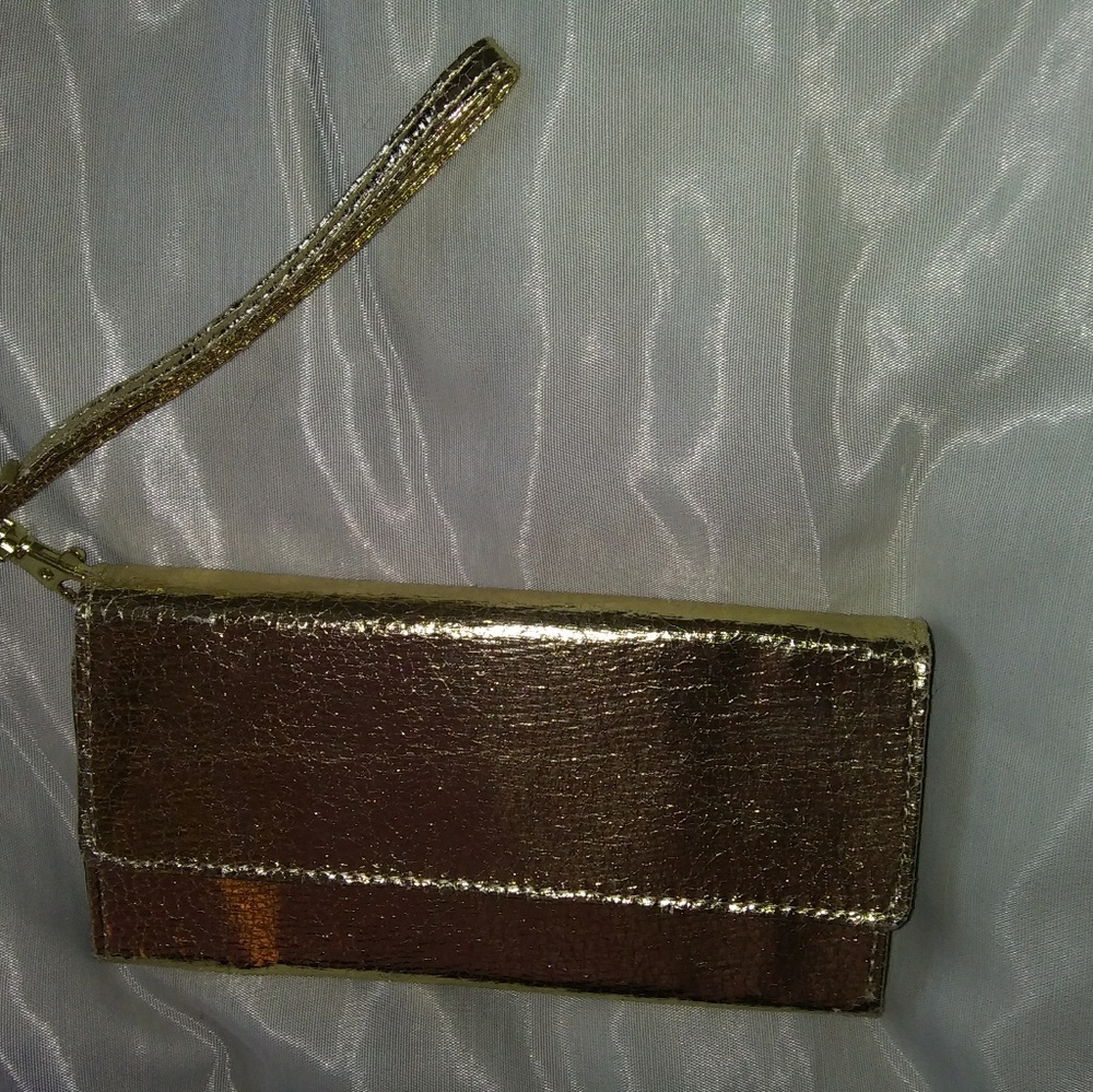 Brand new wristlet with a cellphone holder.